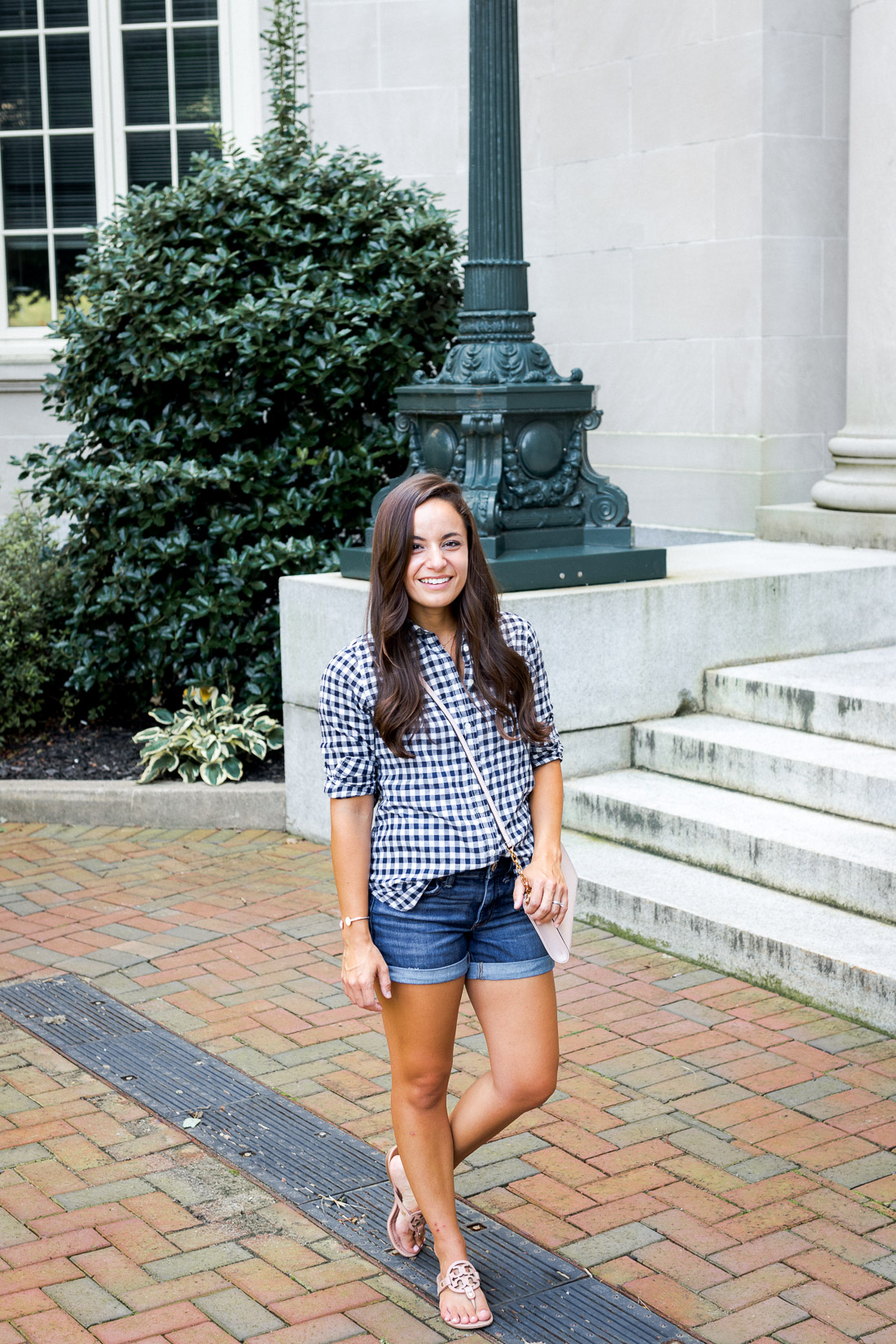 Casual outfit on a petite style blogger. Denim short with a gingham button down and tory burch miller flats. 