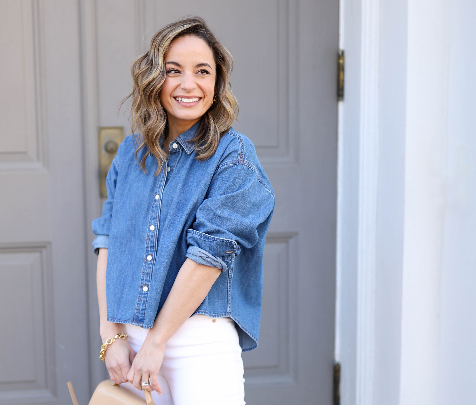 Brooke in chambray shirt and white jeans