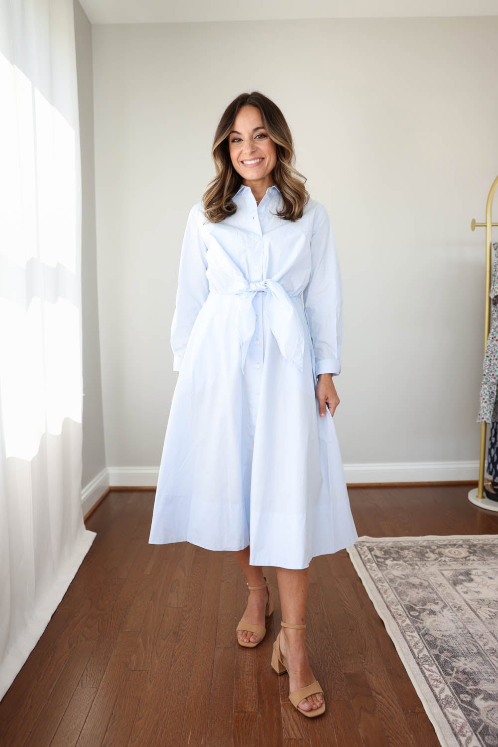 Brooke of Pumps and Push-Ups wearing a light blue midi length shirt dress. Petite-friendly midi dresses. Petite friendly dresses with sleeves.