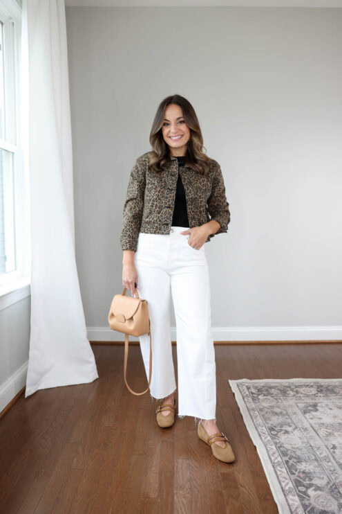 Brooke of Pumps and Push-Ups styling white barrel-leg jeans for fall with a black tank top, leopard print denim jacket, and cognac shoes — a petite-friendly autumn outfit idea.