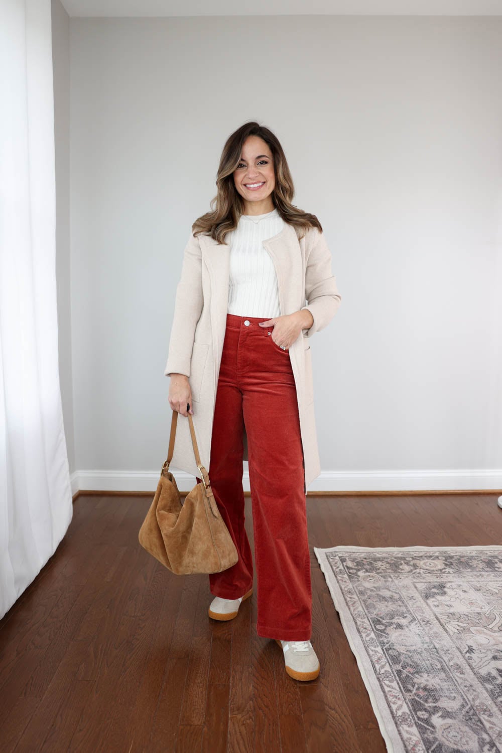 Petite fall outfit: Brooke of Pumps and Push-Ups in full-length corduroy pants, long cardigan, and Gola Elan sneakers.