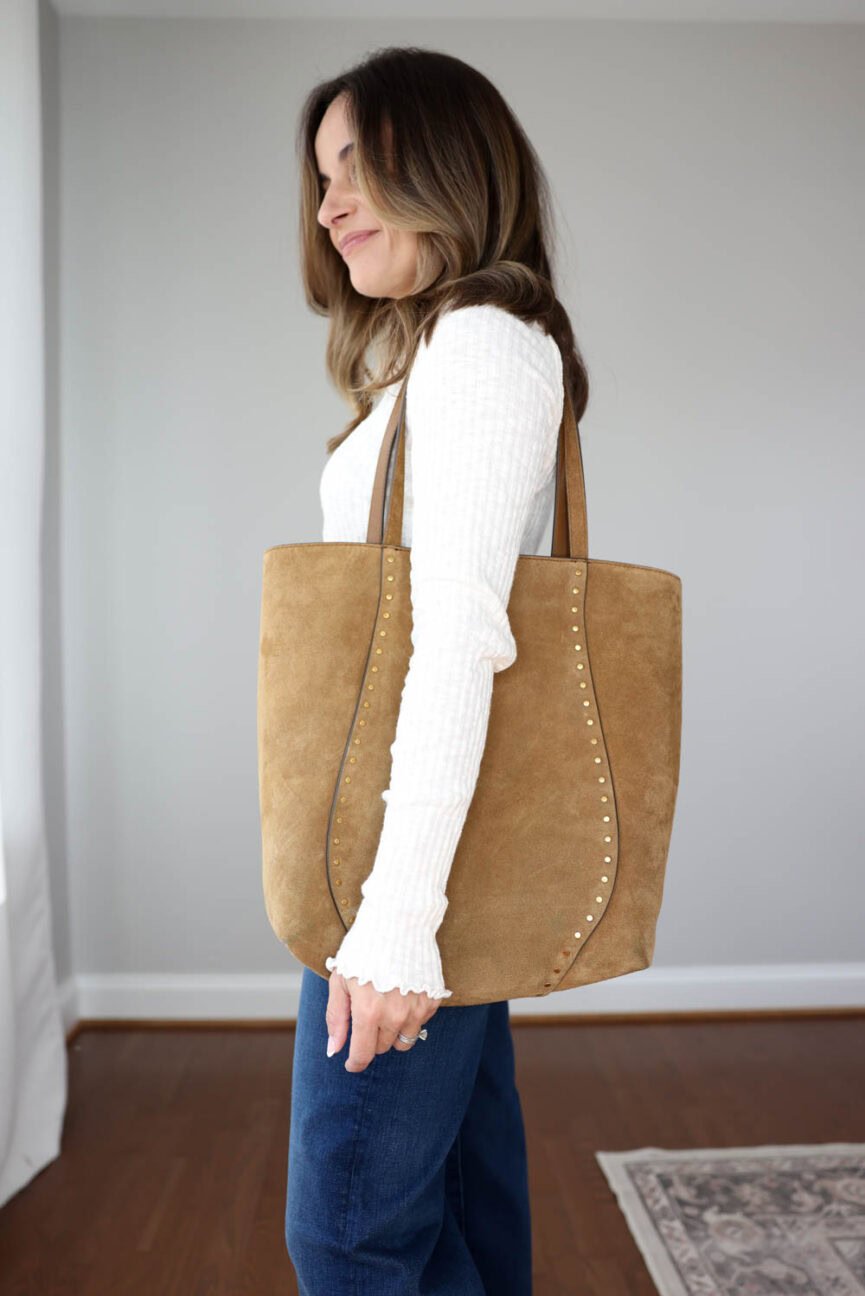 Petite fall outfit with Madewell suede bag styled with jeans and ballet flats.