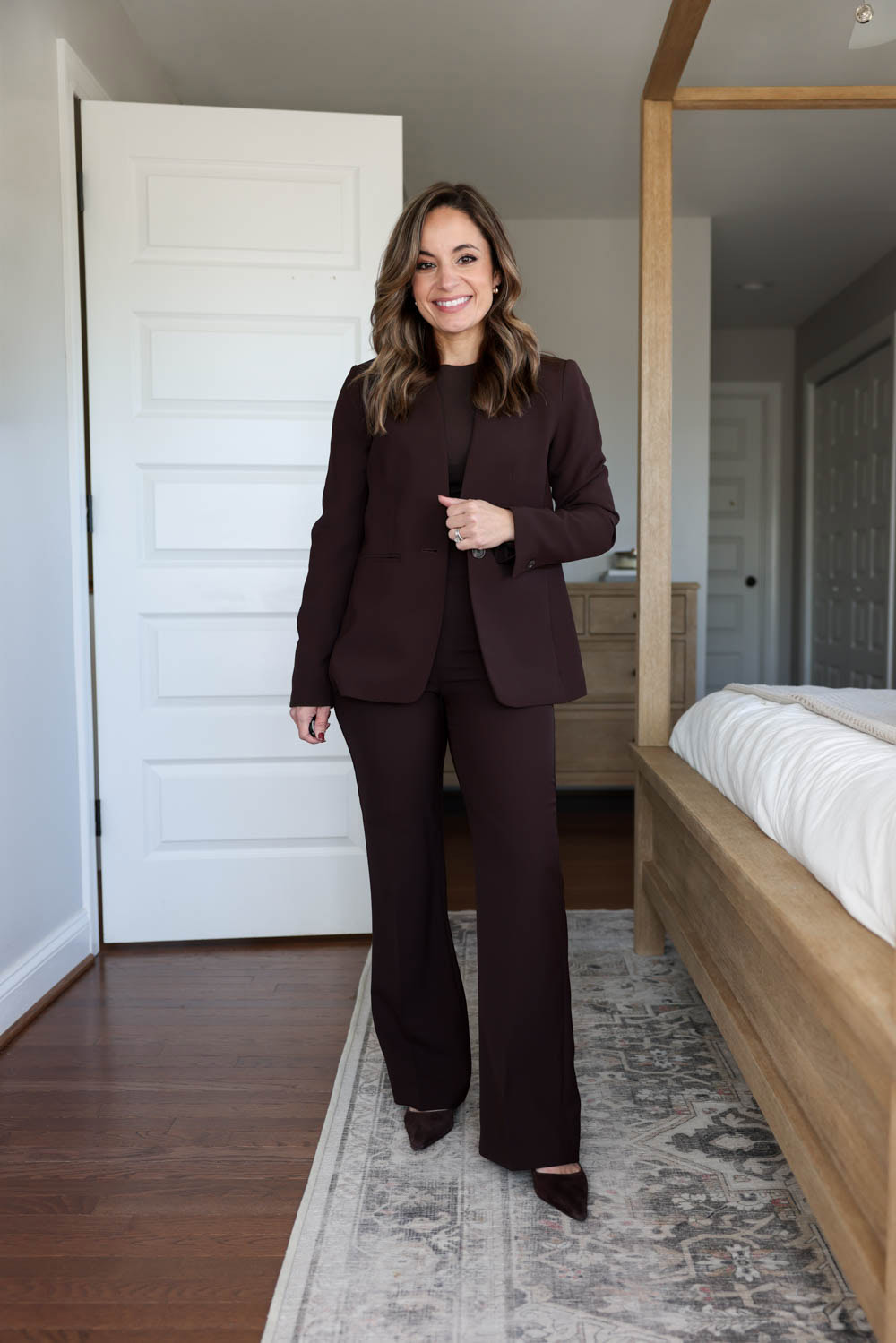 Brooke of Pumps and Push-Ups wearing an Ann Taylor chocolate brown suit — petite-friendly blazer and pants outfit for work in neutral tones.