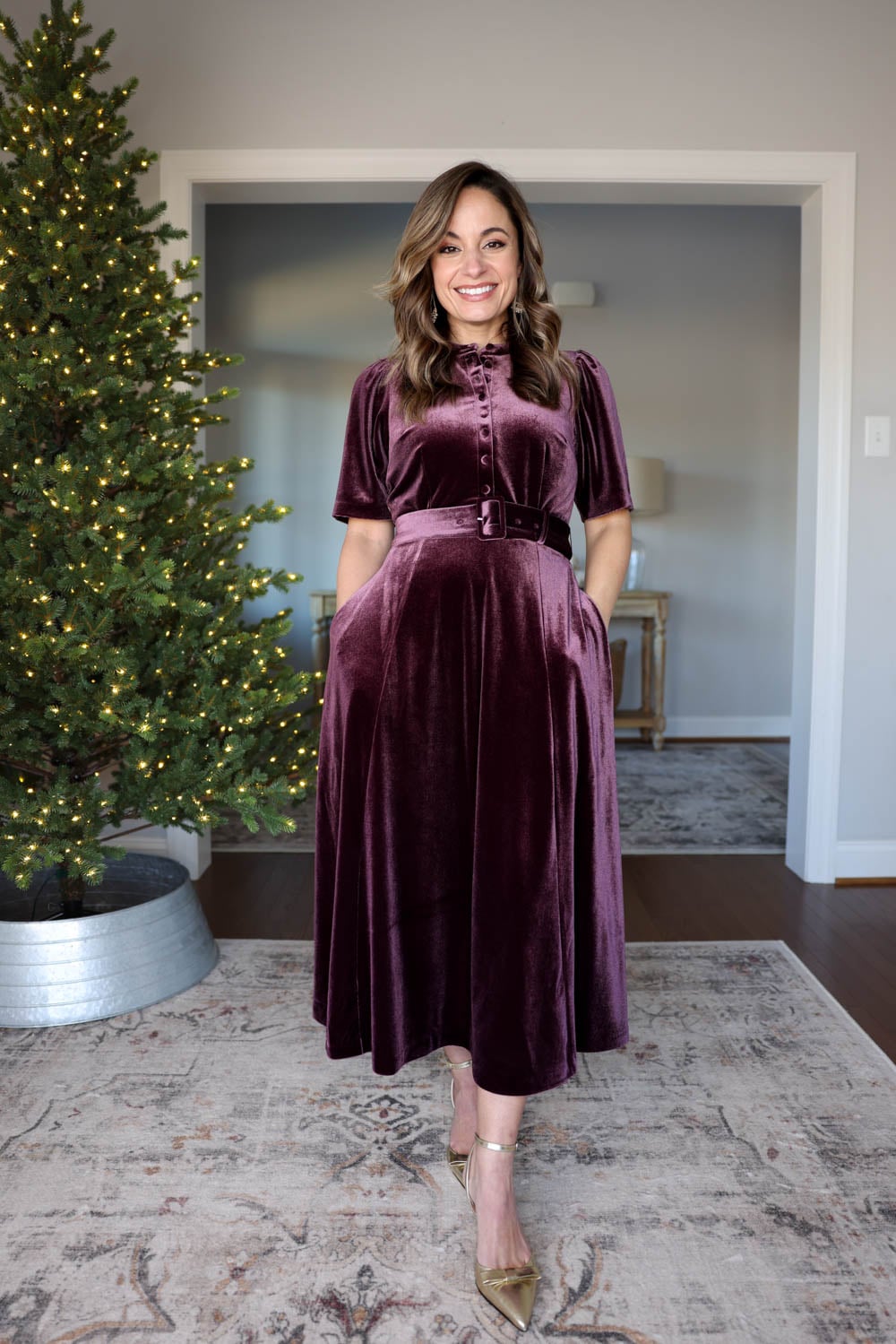 Brooke of Pumps and Push-Ups wearing the Boden Kate Dress in Dark Cherry velvet, belted at the waist for a petite-friendly fit.