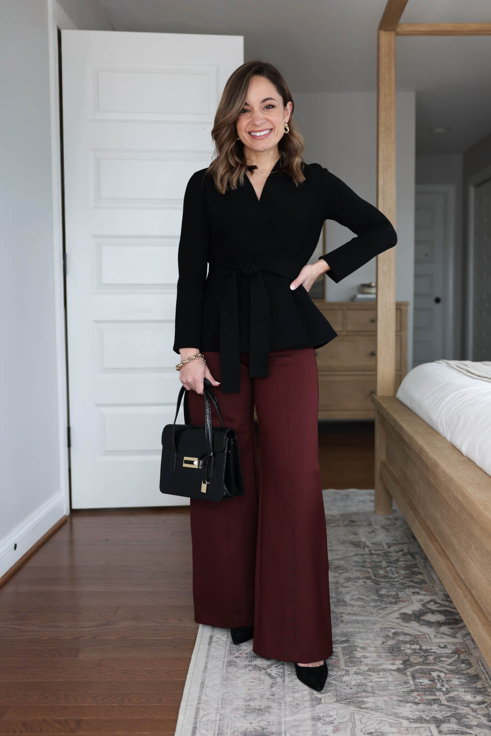 Four ways to wear burgundy pants via petite style blog Pumps and Push-Ups | an outfit for work with ponte burgundy pants and a black wrap cardigan petite-friendly workwear