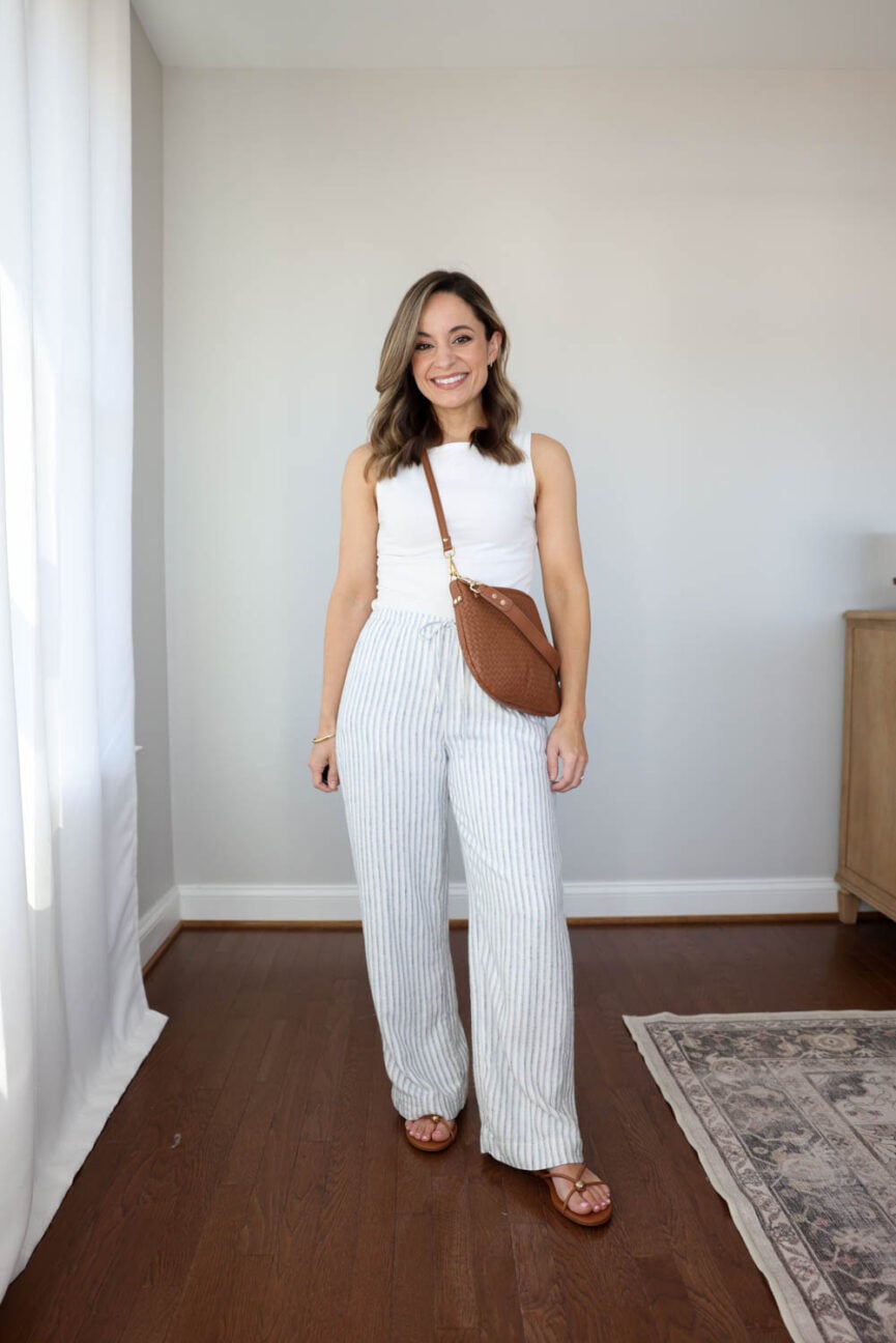 petite spring outfit from a 10-piece capsule wardrobe| simple spring and summer outfit with linen blend shorts and a tank top 