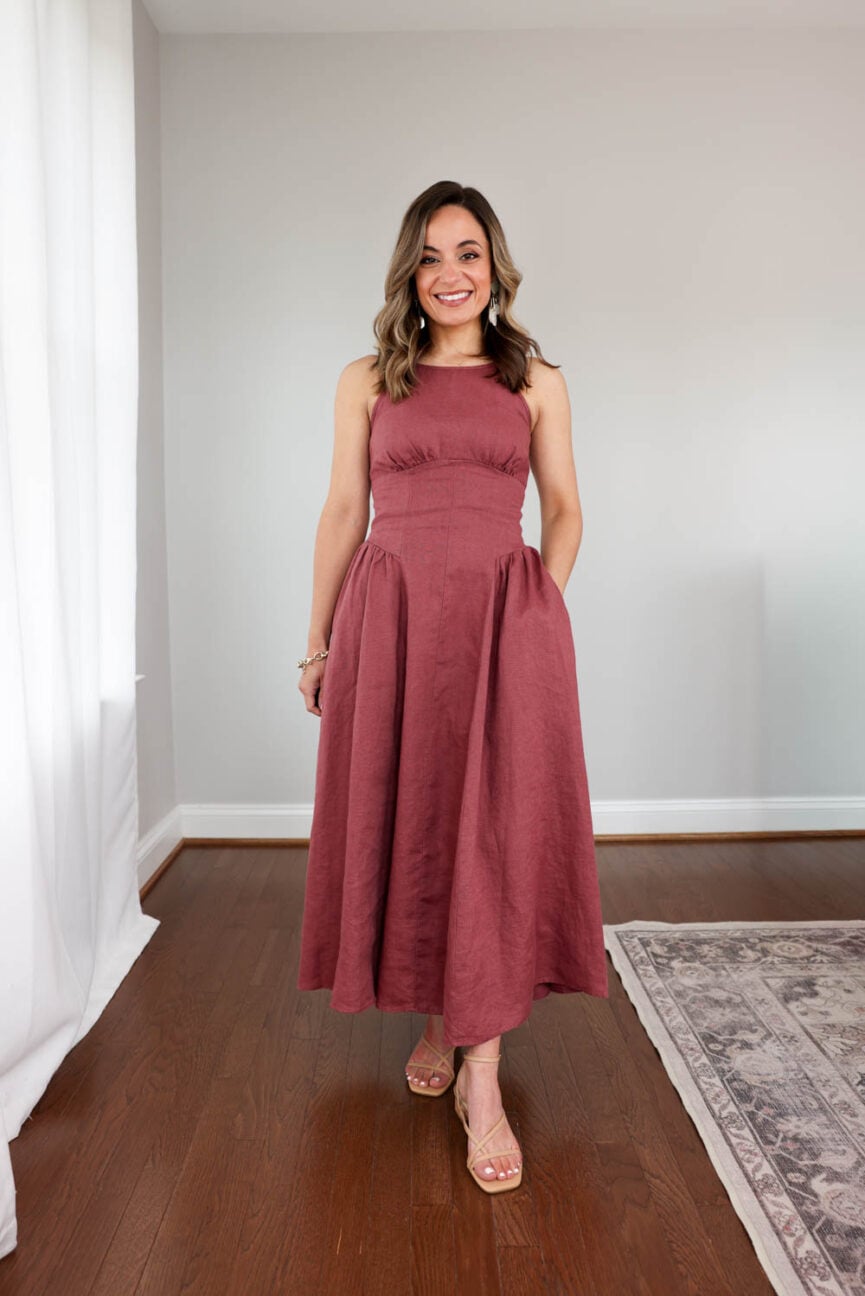 Brooke wearing a 100% linen dress with adjustable tie-back straps and a flowy skirt styled as a petite-friendly summer dress outfit. Linen dresses for petites | petite friendly maxi dresses