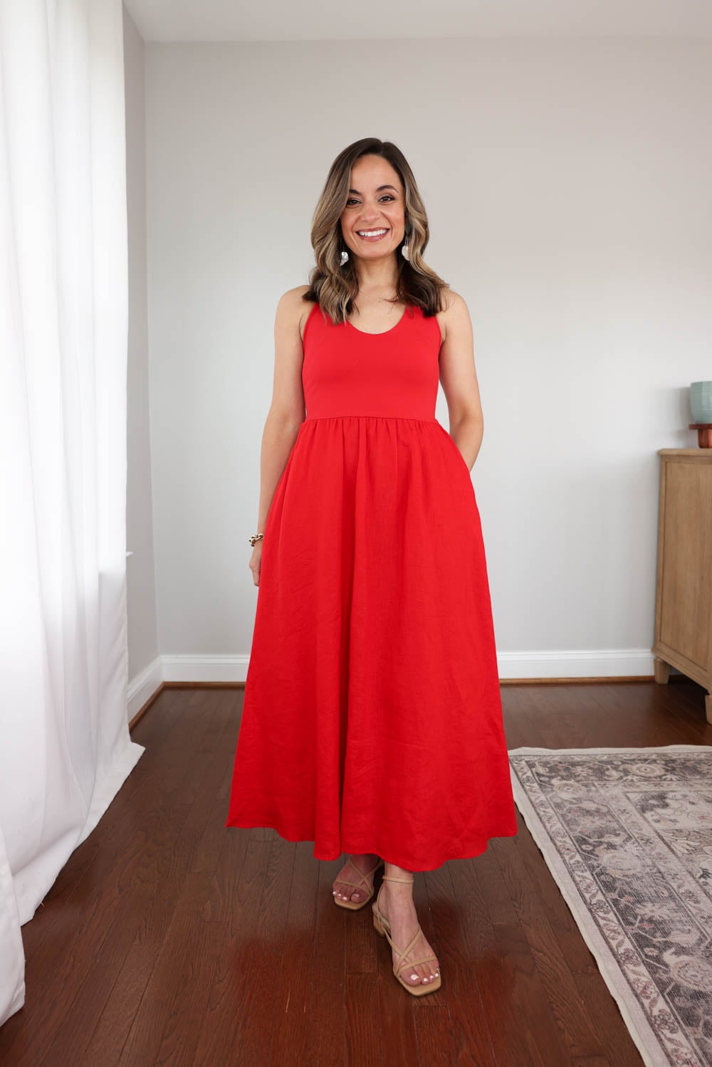 Brooke wearing the J.Crew Mixy Halter Dress in poppy red with a cotton jersey top and flowy linen maxi skirt styled as a petite-friendly summer dress outfit. Petite-friendly linen dresses.