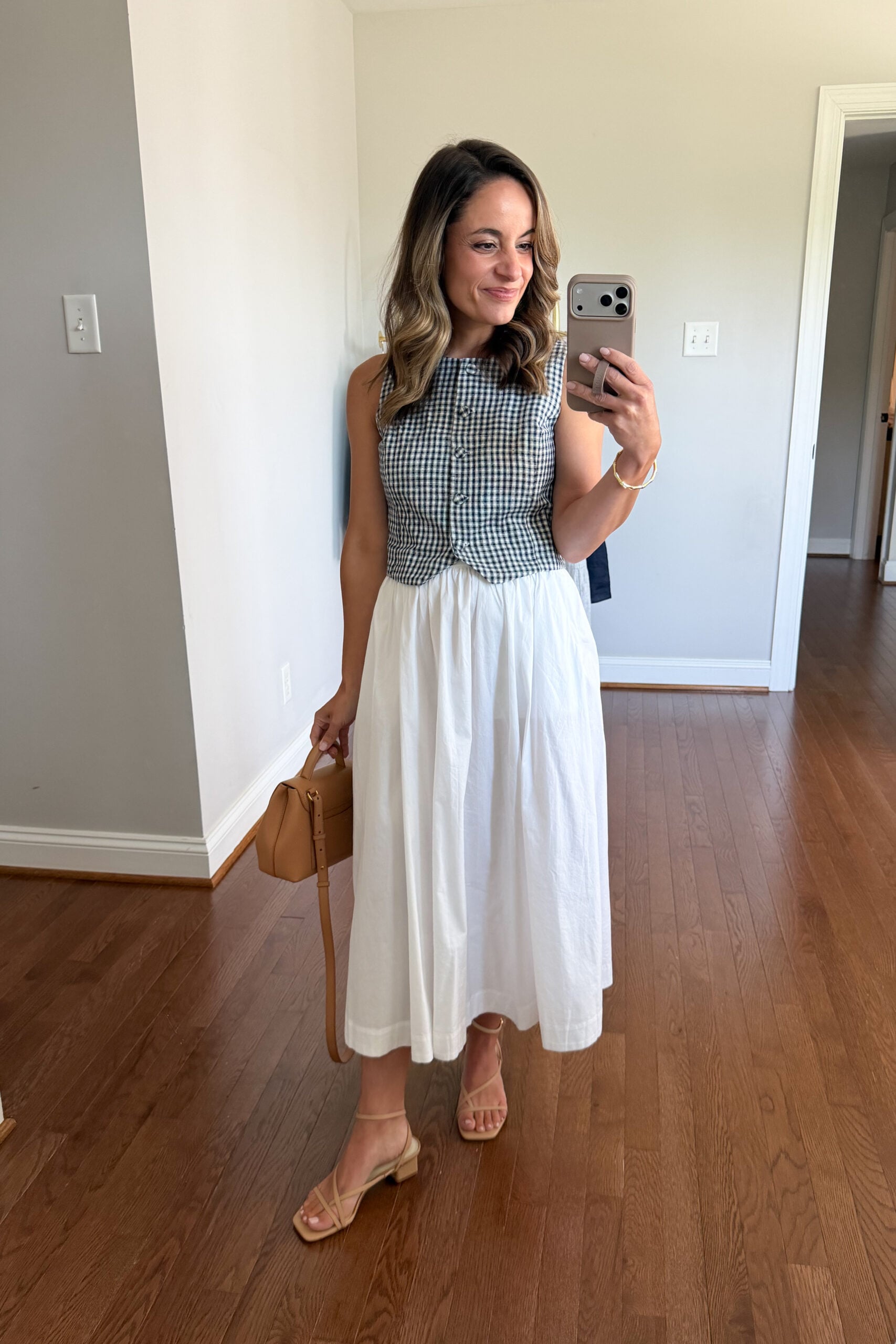 Four ways to style a white cotton poplin midi skirt | petite friendly summer outfit with a cropped vest and midi cotton skirt 